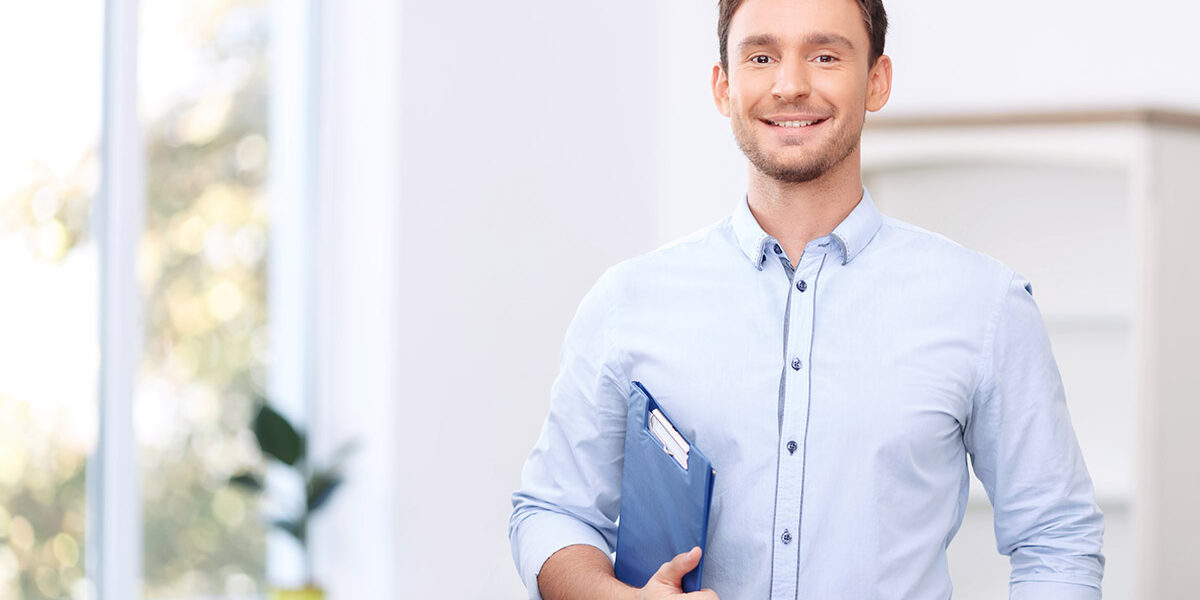 Nice realtor holding folder