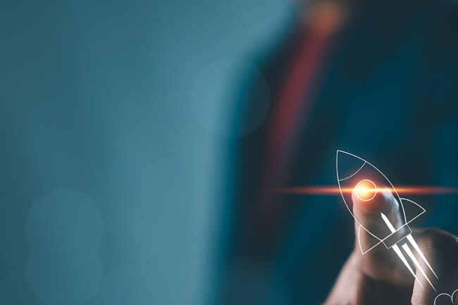 Businessman touching on rocket launch with up arrow, investment growth, planning and starting corporate business start up aiming objective value development leadership and customer target group.